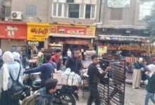 حملات دورية لرفع الإشغالات والتعديات من الطرق العامة بأحياء إمبابة والمنيرة الغربية بالجيزة